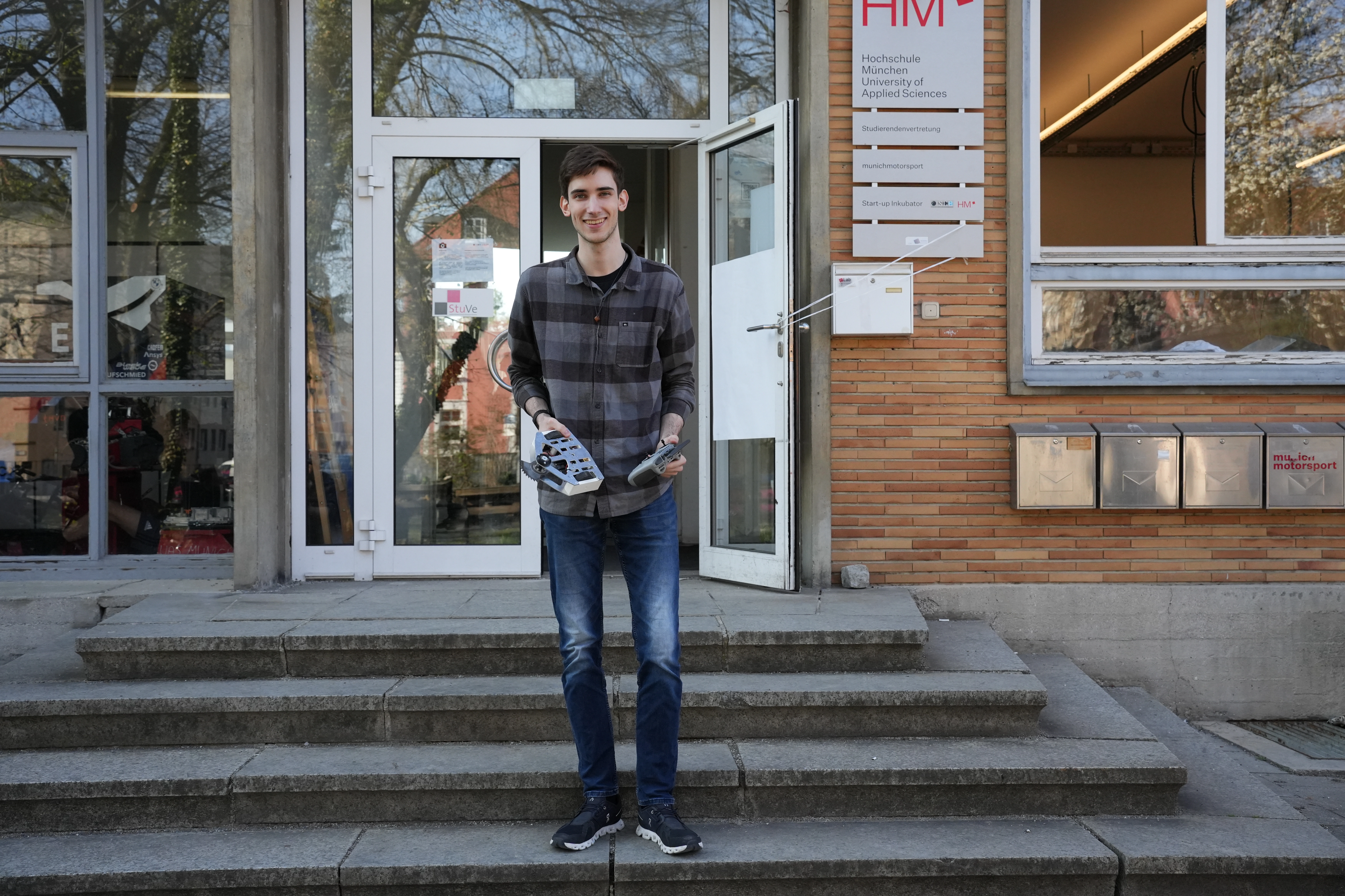 Picture of me holding the bot at the preccelerator